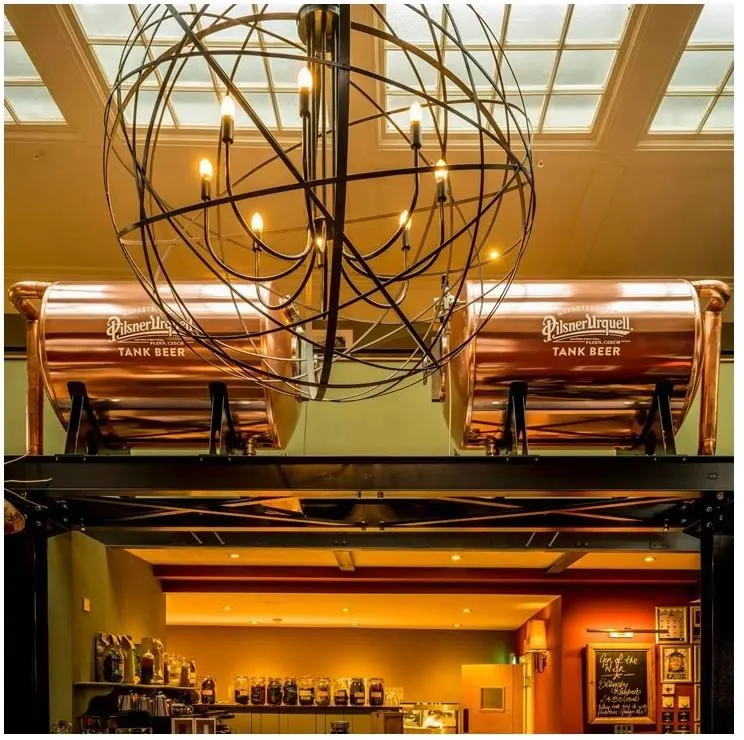 Bar with copper tank beer vessels and painted ceiling, York