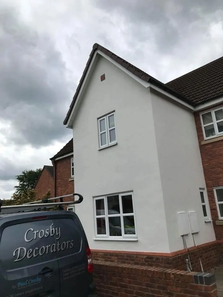 House exterior repainted in white with the Crosby Decorators van outside, York