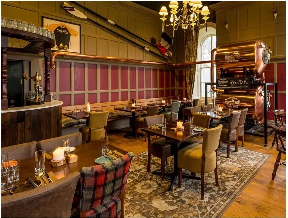 Pub dining area with painted panelling and red feature panels, York